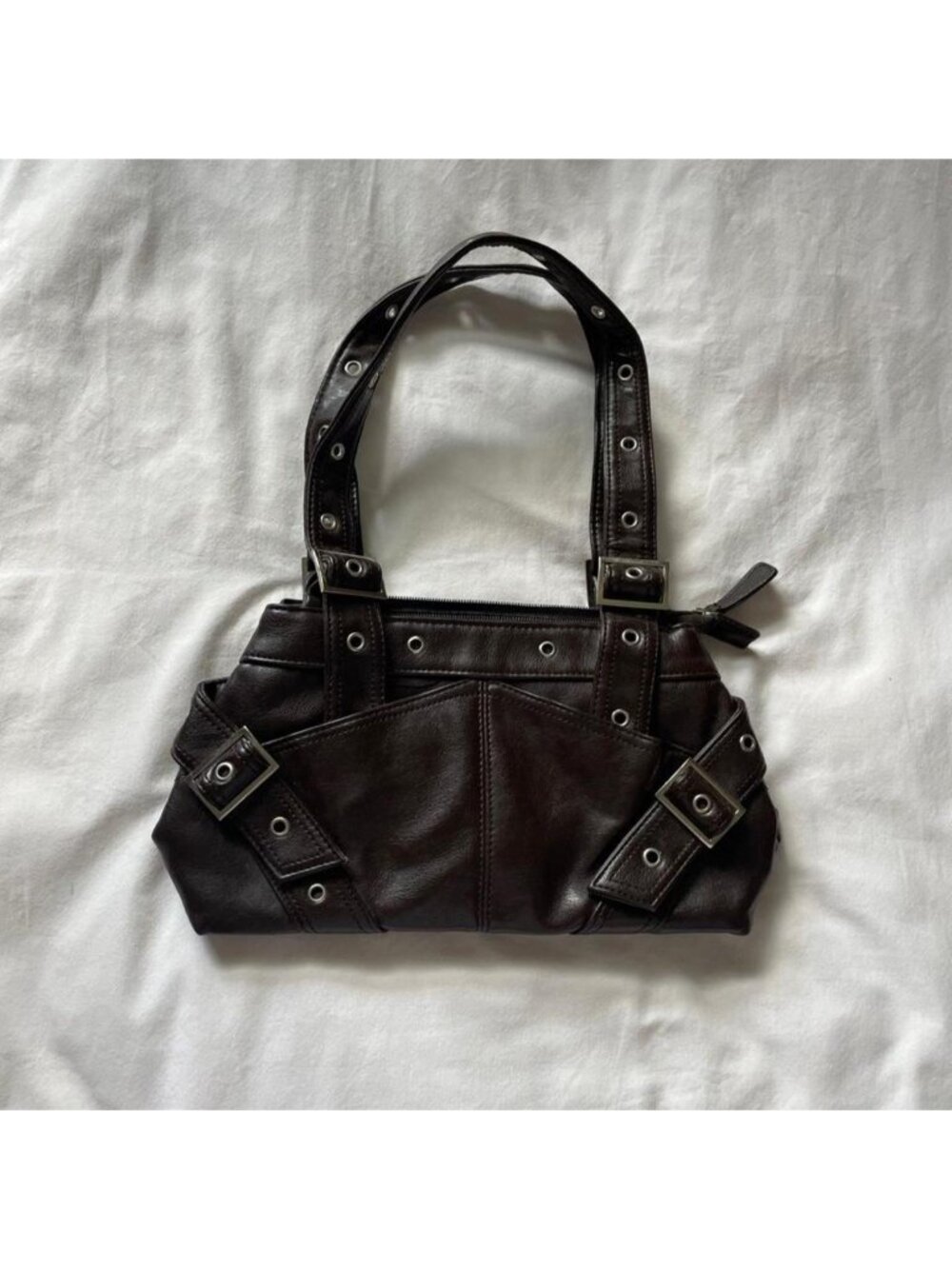 Brown faux leather purse with buckles and straps